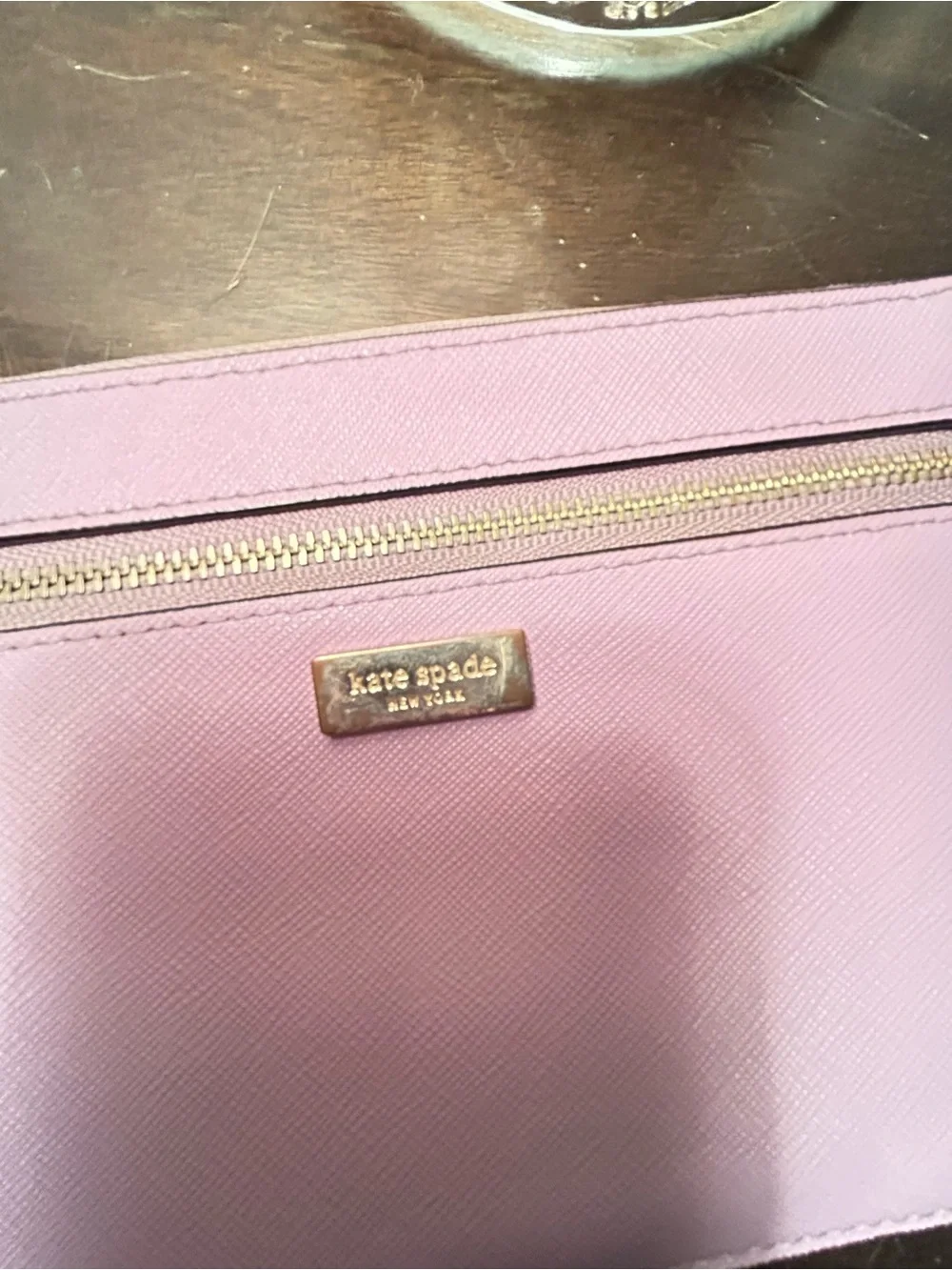 kate spade mauve wristlet with front zip pocket